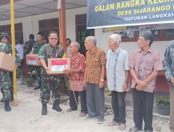 Tim Wasev Mabesad TMMD Ke 129 Lakukan Aksi Sosial Bagikan Bingkisan Tali Asih Kepada Warga Desa Sijarango